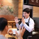 Starbucks employee communicating in Sign Language