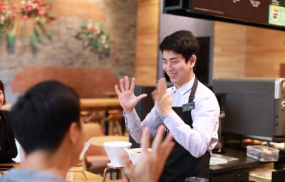 Starbucks employee communicating in Sign Language