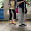two blind people walking at the platform