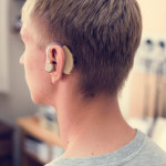 Young man with hearing aid