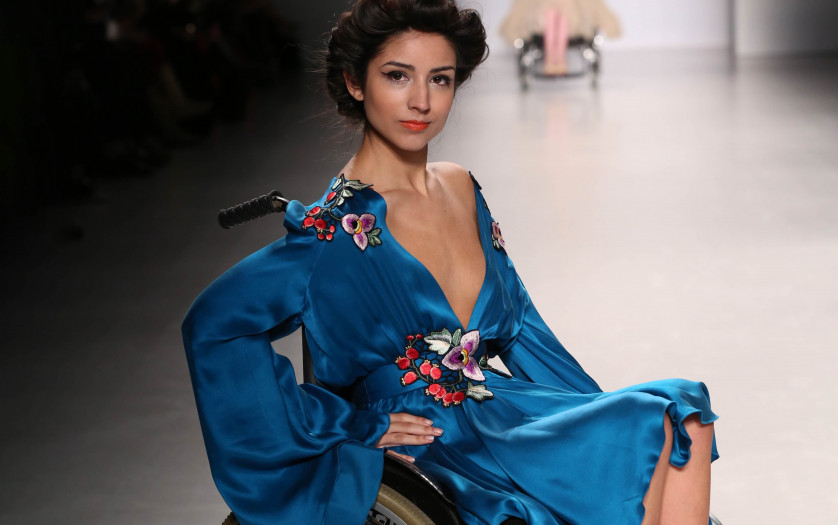 a model in wheelchair walks the runway at the FTL Moda fashion show