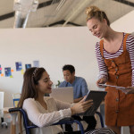 boss talking with intern with disability