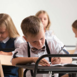 School children in classroom at lesson