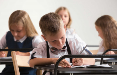 School children in classroom at lesson
