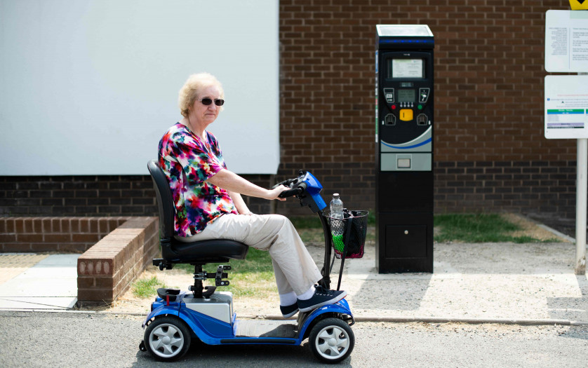 Senior woman on an electric wheelchair