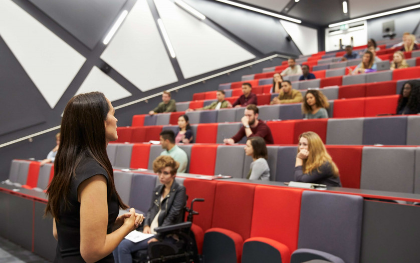 Woman lecturing students in a university