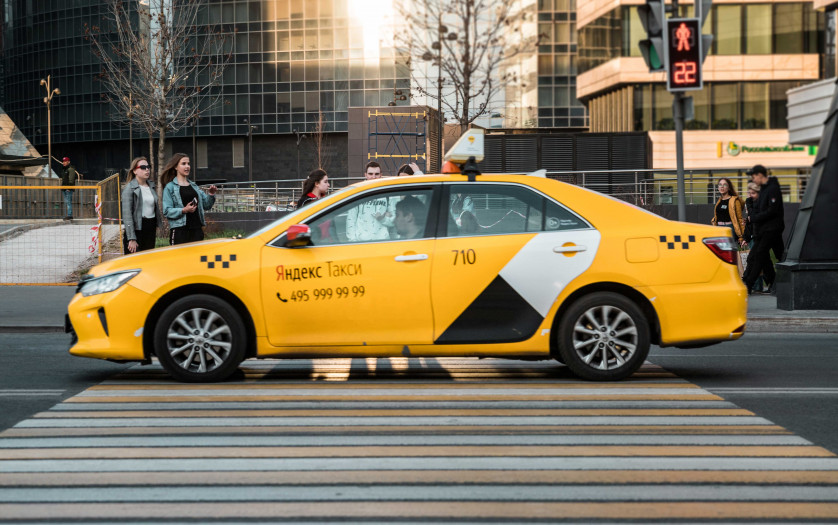 A yellow yandex taxi on the Moscow streets