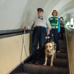Blind Man traveling with guide dog