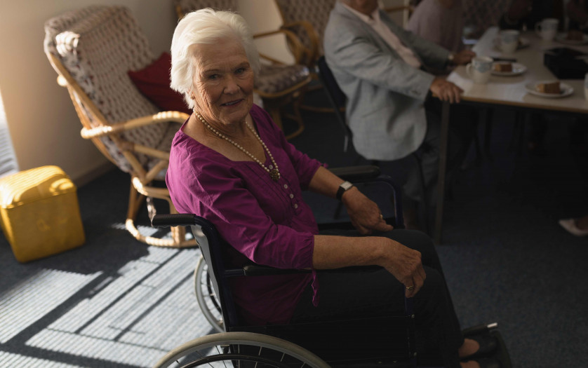 disabled senior woman sitting on wheelchair