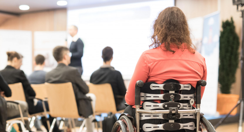 woman on wheelchair attending the conference
