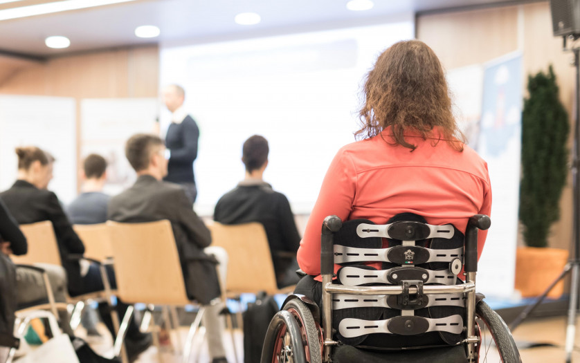 woman on wheelchair attending the conference