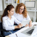 woman in wheelchair working in the office