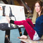 young artist with disability painting incredible scenes in attic by holding paintbrush in her toes