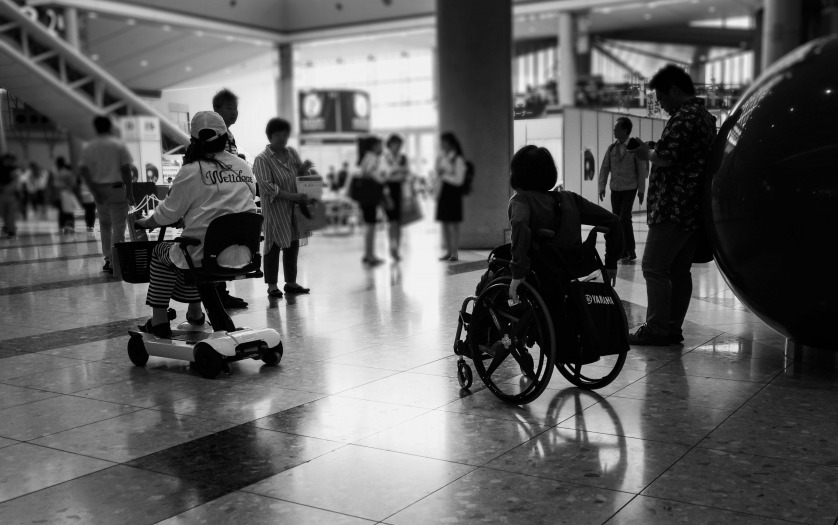 Wheelchair users entering in a building