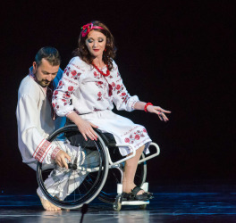 Modern ballet performed by woman in wheelchair and her dance partner