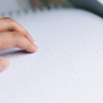 person reading braille