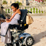 women in wheelchair using mobile phones