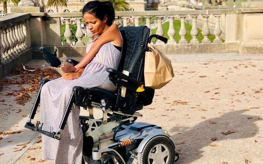 women in wheelchair using mobile phones