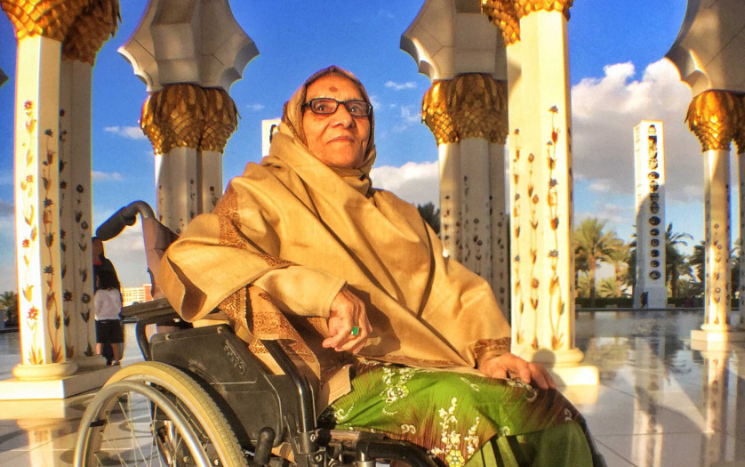 woman in wheelchair inside mosque