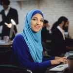Arabian lady in wheelchair working