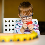 boy with disability playing
