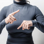 Woman speaks sign language