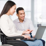 woman in wheelchair working