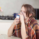 young-woman doing inhalation at home