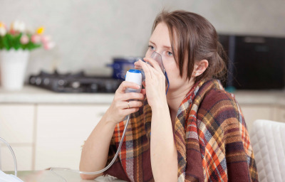young-woman doing inhalation at home
