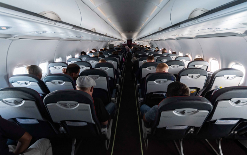 Single-Aisle Airplane cabin seats with passengers