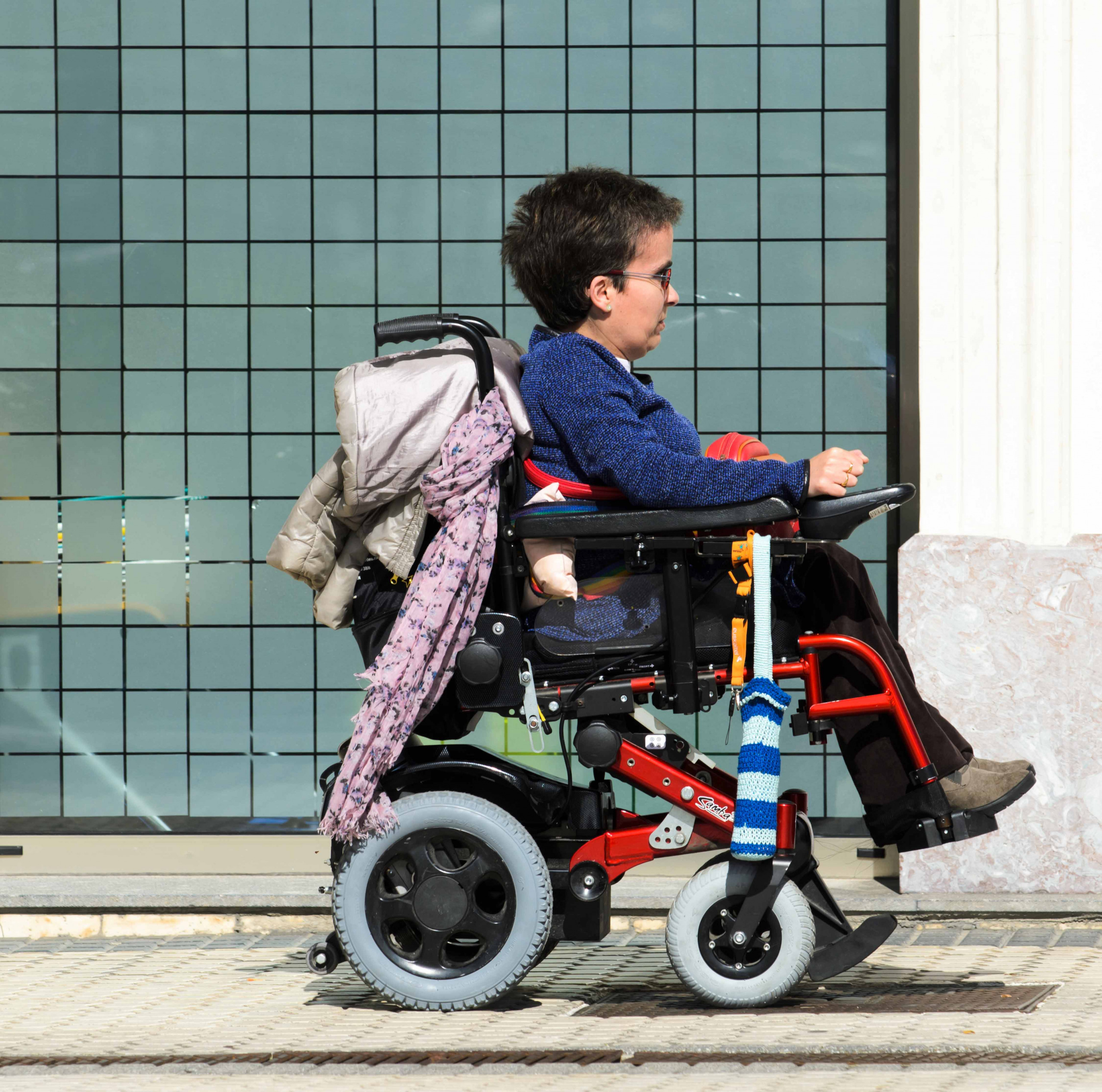 A young woman in a electronic wheelchair