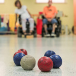 Close up of little balls, Boccia players with disabilities playing.