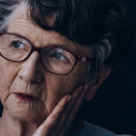Elderly lonely woman with Alzheimer