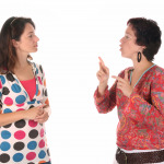 Two women chatting in sign Language