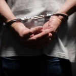 teenage in handcuffs