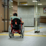 Wheelchair user entering in the building in Tokyo