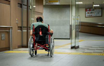 Wheelchair user entering in the building in Tokyo