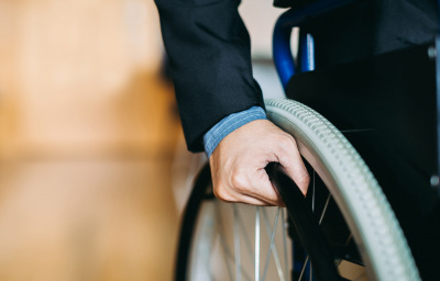 close up hands for a wheelchair user