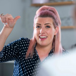 Two Women Have Conversation At Home Using Sign Language