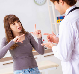 Deaf female patient visiting young male doctor