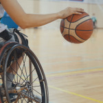 Athlete in wheelchair playing basketball