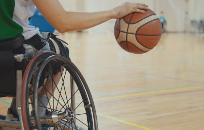 Athlete in wheelchair playing basketball