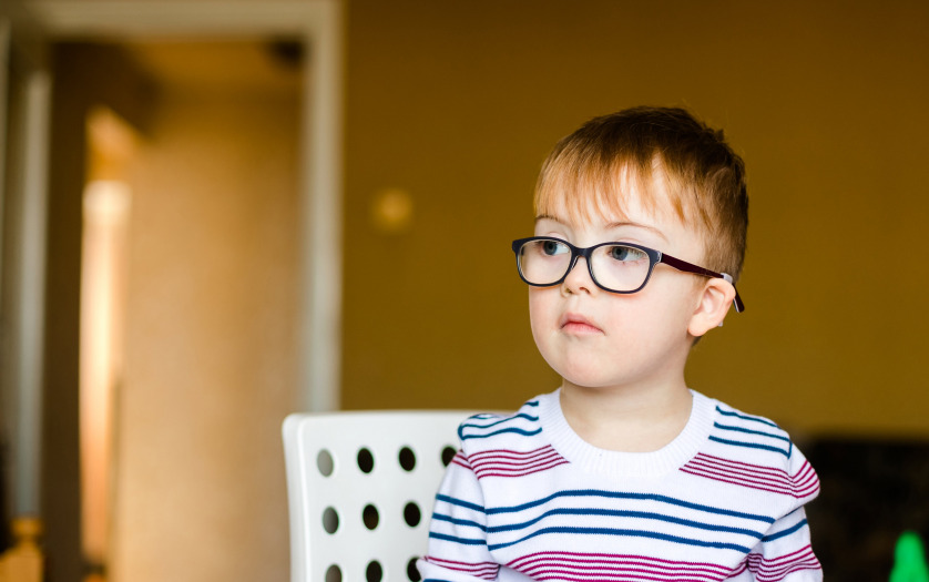 Little boy in the glasses with disability