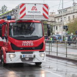Fire brigade workers are riding fire truck crane in Prague, Czech Republic