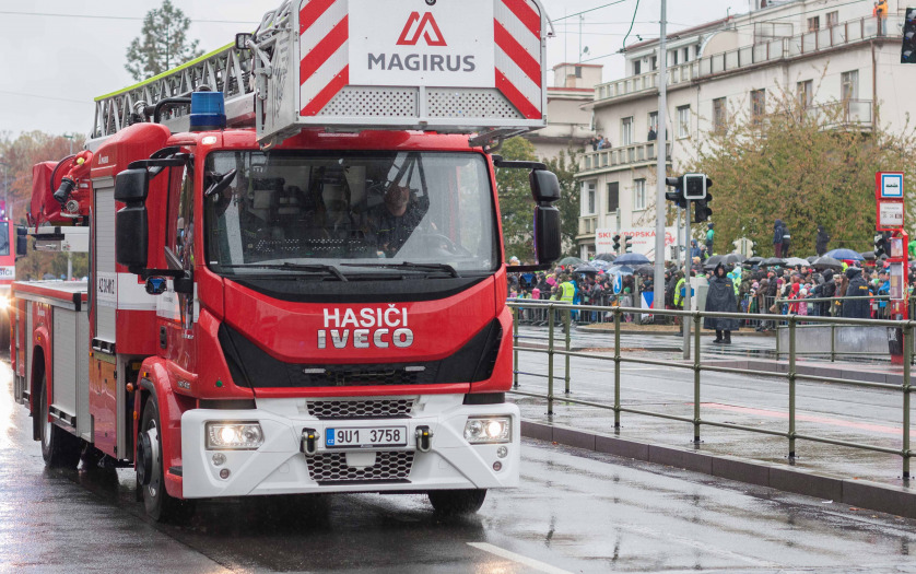 Fire brigade workers are riding fire truck crane in Prague, Czech Republic