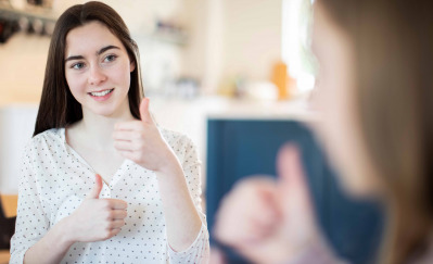 Teenage Girls Having Conversation Using Sign Language