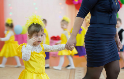 A child with Down syndrome at the dance event