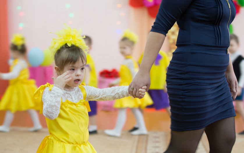 A child with Down syndrome at the dance event