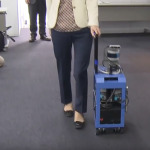 Chieko Asakawa is demonstrating how to use a AI suitcase