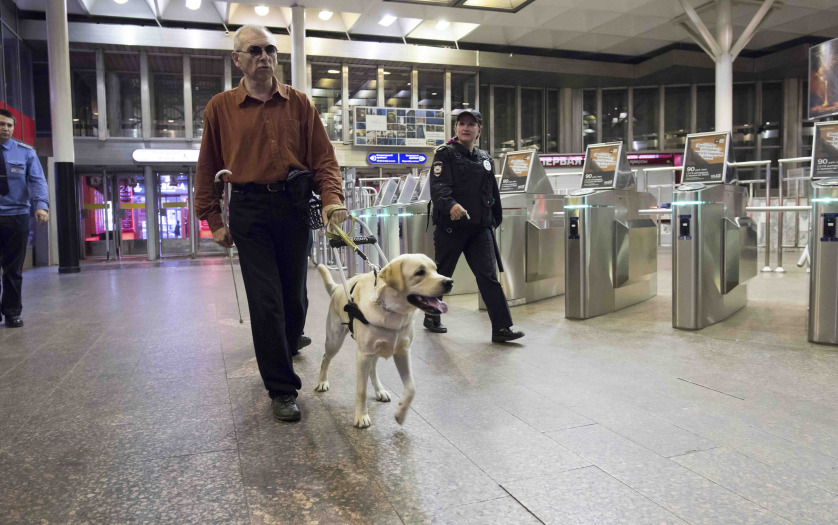 a blind man with guide dog